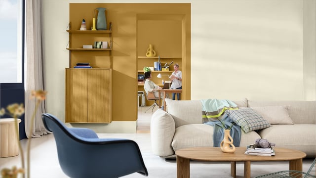 Modern living room with sofa, wood furniture, and a warm yellow-brown wall niche